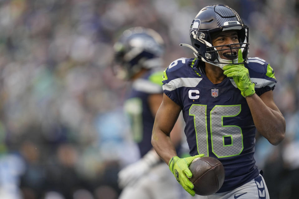 Seattle Seahawks wide receiver Tyler Lockett (16) celebrates his touchdown against the Carolina Panthers during the first half of an NFL football game, Sunday, Dec. 11, 2022, in Seattle. (AP Photo/Gregory Bull)