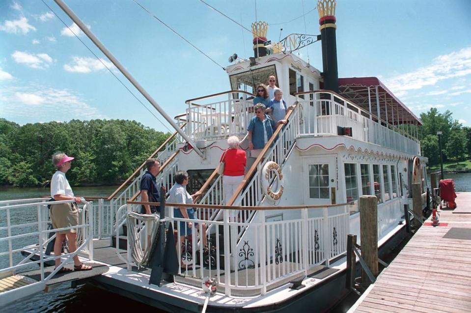 In this August 1998 file photo, passengers board the Catawba Queen sightseeing boat in Mooresville for a ride on Lake Norman. The boat is no longer at Queens Landing as new owners renovate the complex.