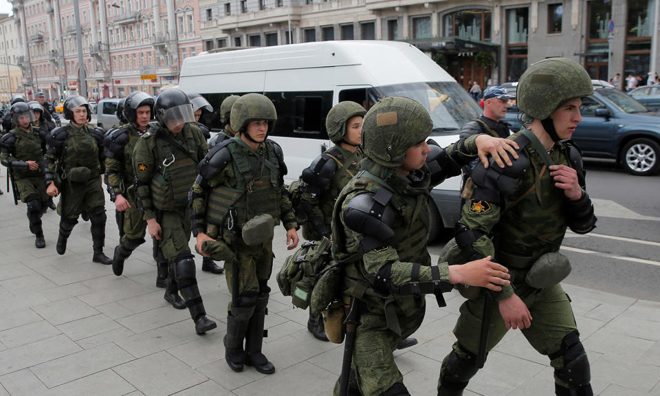 <p>Servicemen of the Russian National Guard walk during an anti-corruption protest organised by opposition leader Alexei Navalny, in central Moscow, Russia, June 12, 2017. (Maxim Shemetov/Reuters) </p>