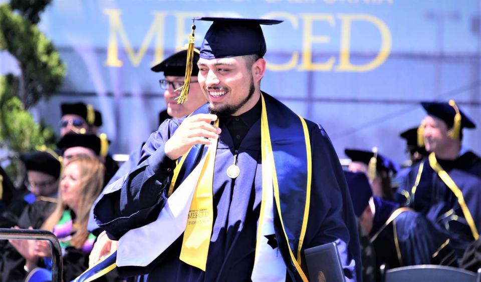 UC Merced graduate Jason Avelar makes his way down from the stage during the 2022 UC Merced Graduation Ceremony on Saturday, May 14, 2022 at UC Merced in Merced, Calif. 