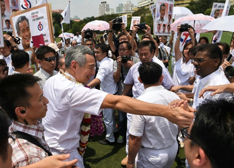 Singapore's Prime Minister Lee Hsien Loong greets his supporters outside the nomination centre, ahead of the general election, on September 1, 2015