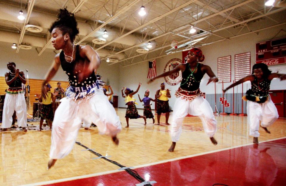 Dancers from the Village Cultural Arts Center in Nashville are performing traditional dances and rhythms at Franklin High School Feb. 29, 2000. The event was sponsored by the downtown Franklin library as part of Black History Month.