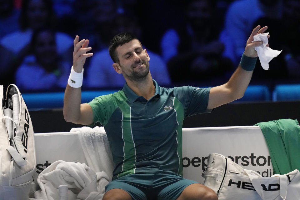 Serbia's Novak Djokovic reacts during the singles tennis match against Italy's Jannik Sinner, of the ATP World Tour Finals at the Pala Alpitour, in Turin, Italy, Tuesday, Nov. 14, 2023. (AP Photo/Antonio Calanni)