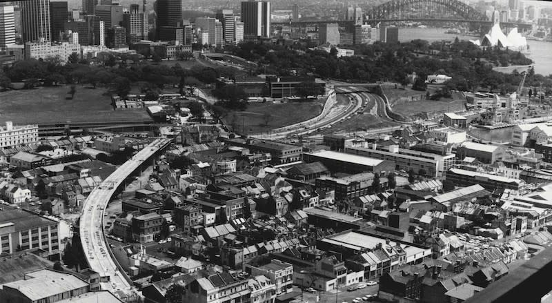 A black and white aerial view of Sydney's Eastern Suburbs railway viaduct in 1971. Harbour Bridge in the background. Photo by Martin James Brannan/Fairfax Media via Getty Images).