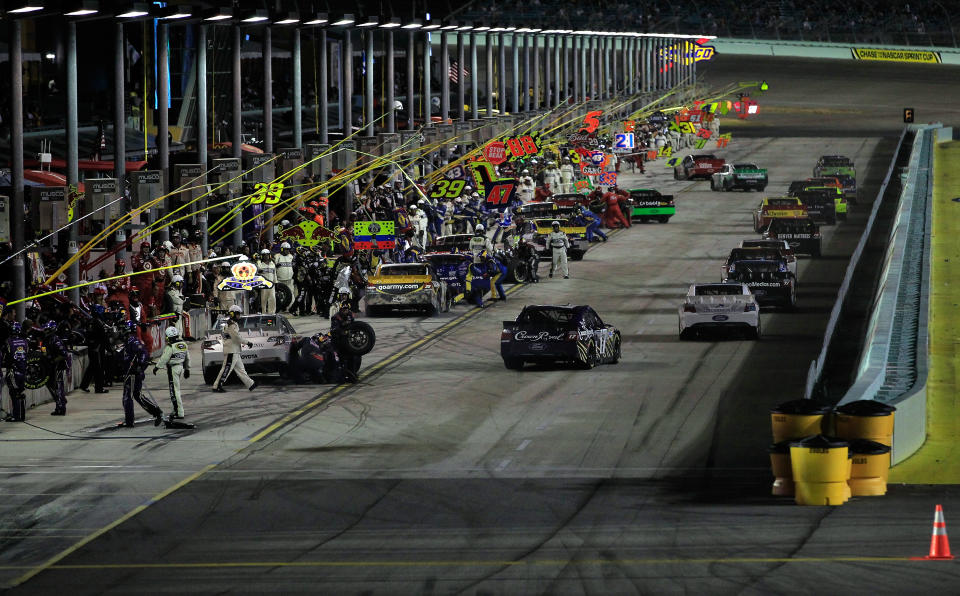 HOMESTEAD, FL - NOVEMBER 20: Cars drive off of pit road during the NASCAR Sprint Cup Series Ford 400 at Homestead-Miami Speedway on November 20, 2011 in Homestead, Florida. (Photo by Chris Trotman/Getty Images for NASCAR)