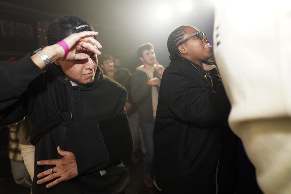 Attendees join in a dance line at The Cove, a pop-up, 18-and-up Christian nightclub, on Saturday, Feb. 17, 2024, in Nashville, Tenn. More than 200 racially and ethnically diverse young clubbers attended The Cove's fourth event. (AP Photo/Jessie Wardarski)