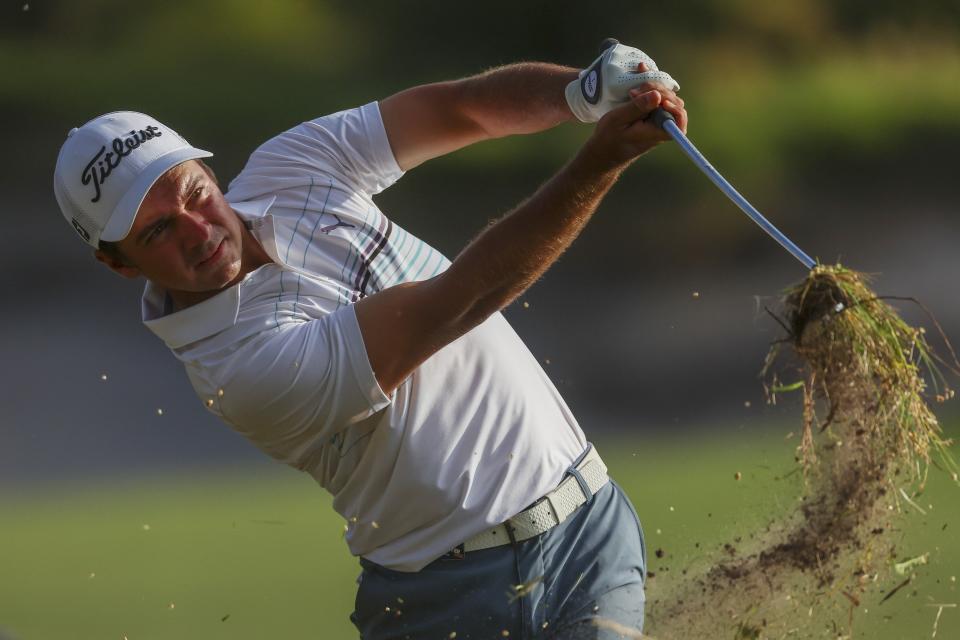 Australia's David Micheluzzi plays out of the rough on the 18th hole during the Australian Open golf championship at Victoria golf course in Melbourne, Australia, Saturday, Dec. 3, 2022. (AP Photo/Asanka Brendon Ratnayake)