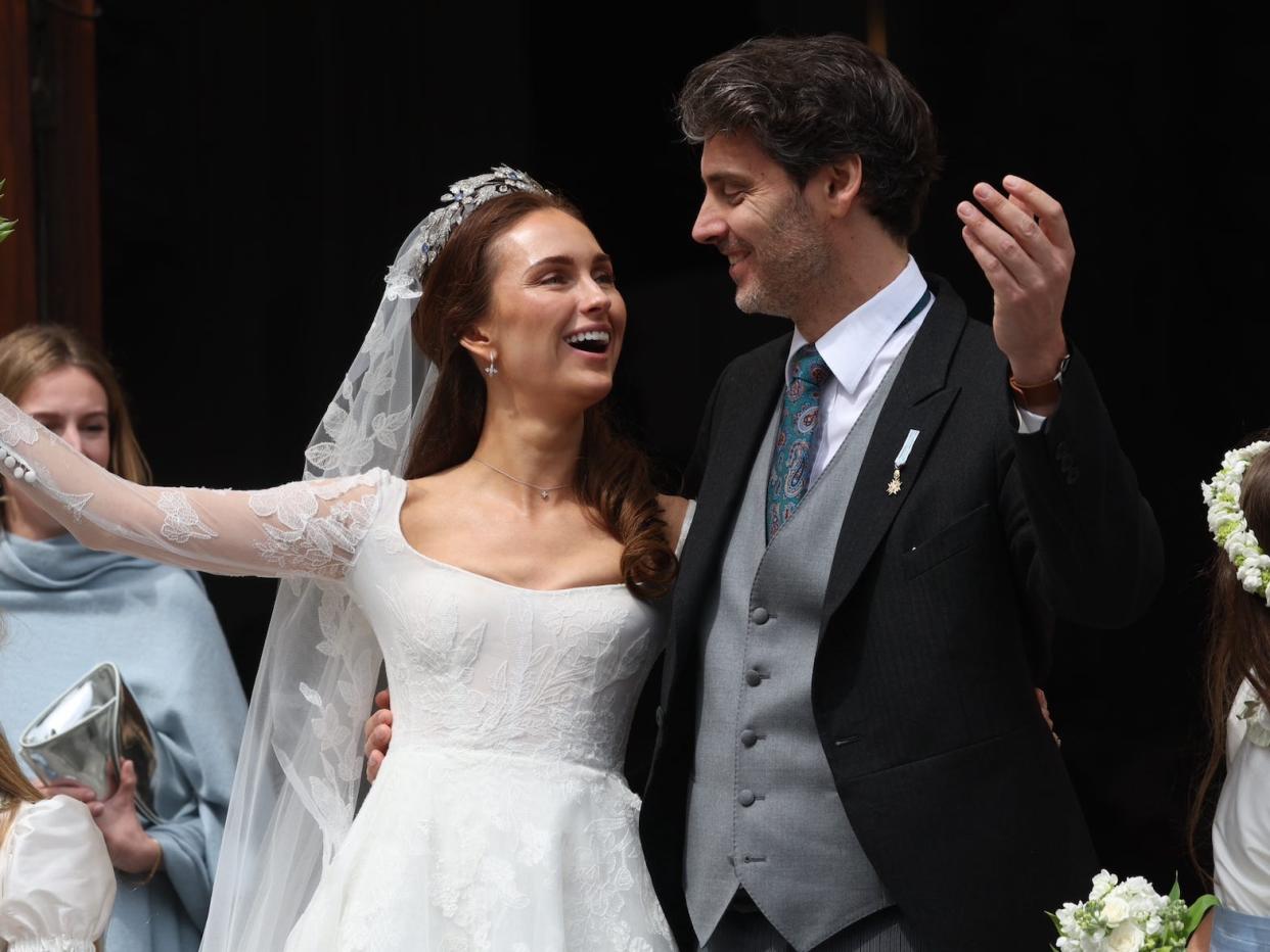 Princess Sophie and Prince Ludwig of Bavaria greet crowds after their wedding.