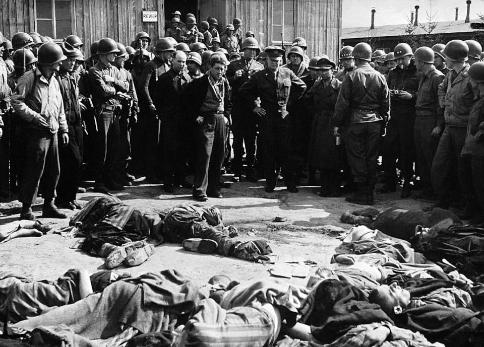 General Dwight D. Eisenhower and soldiers discover 70 prisoner bodies at the Ohrdruf concentration camp, near Buchenwald, who had been executed by the fleeing Nazis. <a href="https://www.gettyimages.com/detail/news-photo/ohrdruf-concentration-camp-near-buchewald-germany-the-news-photo/104404170?adppopup=true" rel="nofollow noopener" target="_blank" data-ylk="slk:Keystone-France/Gamma-Keystone via Getty Images;elm:context_link;itc:0;sec:content-canvas" class="link ">Keystone-France/Gamma-Keystone via Getty Images</a>