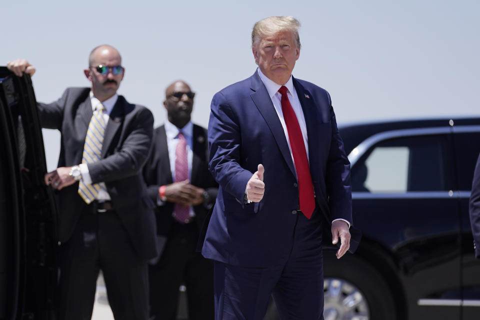 President Donald Trump arrives in Phoenix, Tuesday, May 5, 2020 where he will speak during a roundtable on supporting Native Americans and participate in a tour of a Honeywell International plant that manufactures personal protective equipment, (AP Photo/Evan Vucci)