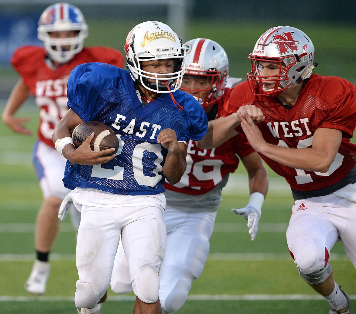 East''s Noah Durst-Hawkins of Alliance sprints down the sideline for a long gain during the 30th annual Repository East-West All-Star Football Game at GlenOak, July 20, 2019.