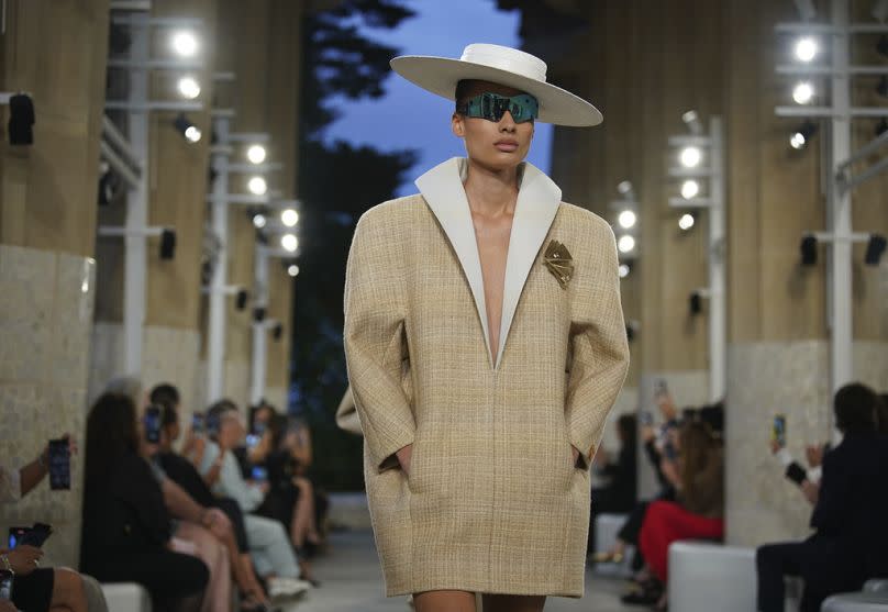 A model wears a creation by Louis Vuitton during a fashion show for the Cruise 2025 collection in the Park Guell in Barcelona, Spain, Thursday, May 23, 2024.