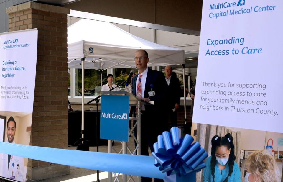 MultiCare Capital Medical Center President Will Callicoat welcomes about 100 people, including staff members, local dignitaries and others in the medical field, to the July 25 ribbon-cutting ceremony celebrating the new MultiCare Capital Women’s Integrated Primary Care clinic in west Olympia.
