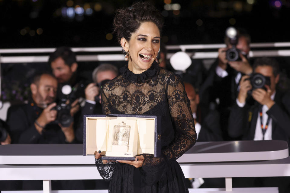 FILE - Zar Amir Ebrahimi, winner of best actress for her role in "Holy Spider" holds her award following a ceremony at the 75th international film festival, Cannes, southern France, on May 28, 2022. Ebrahimi stars in Ali Abbasi’s “Holy Spider,” playing a journalist investigating a serial killer in the eastern Iranian city of Mashhad who is murdering women and sex workers. (Photo by Vianney Le Caer/Invision/AP, File)