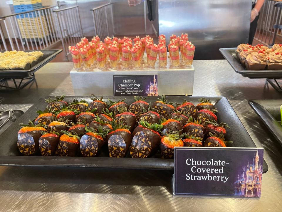 desserts laid out on trays for a magic kingdom fireworks desserts party