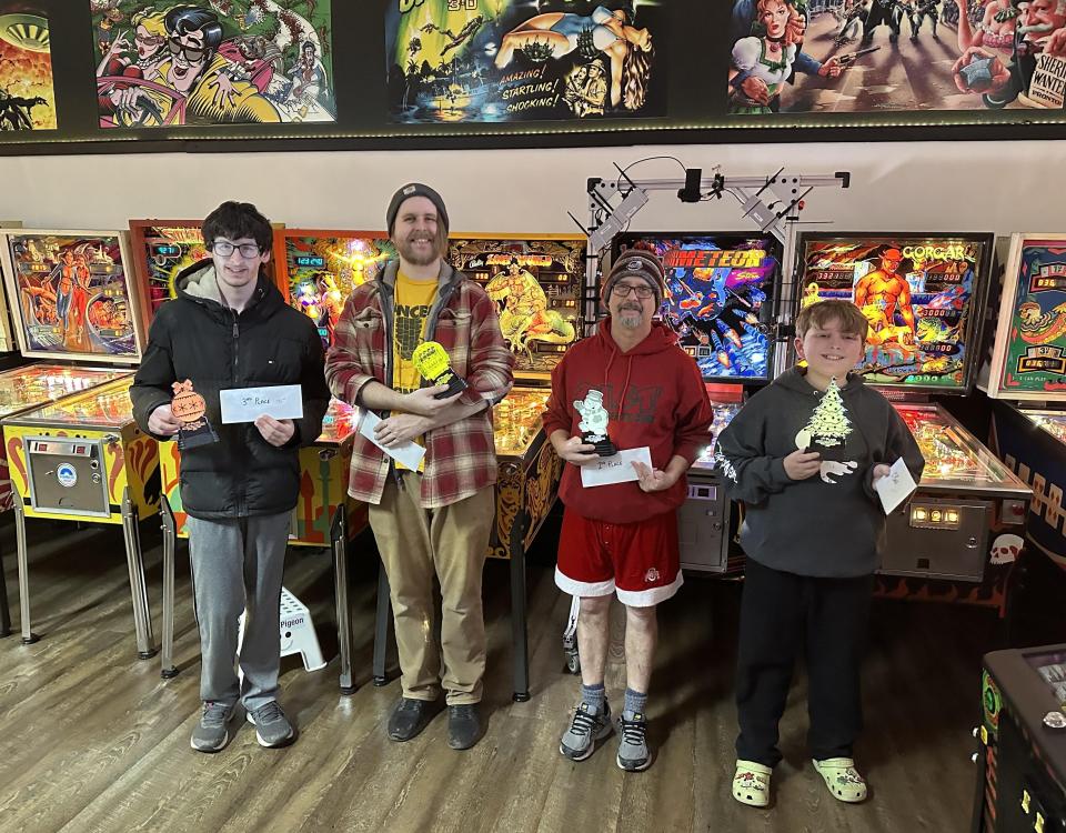 More than 60 players competed at the annual Holiday Extravaganza pinball tournament on Dec. 30, 2023. Pictured are third place winner Jared August, left, fourth place winner Tyrus Eagle, second place winner Trent Augenstein and first place winner Sterling Mitoska.