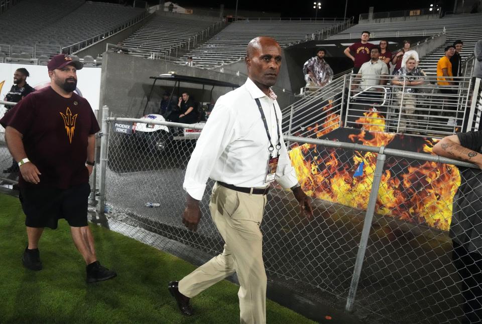 Arizona State vice president for university athletics Ray Anderson walks over to talk to president Michael Crow during the season opener against the Southern Utah Thunderbirds in the second half at Mountain America Stadium in Tempe on Sept. 1, 2023.