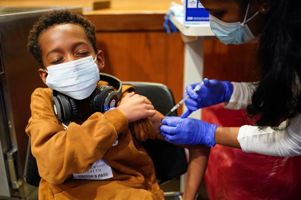 Cameron West, 9, receives a COVID-19 vaccination at Englewood Health in Englewood, New Jersey. Health officials hailed shots for kids ages 5 to 11 as a major breakthrough after more than 18 months of illness, hospitalizations, deaths and disrupted education.