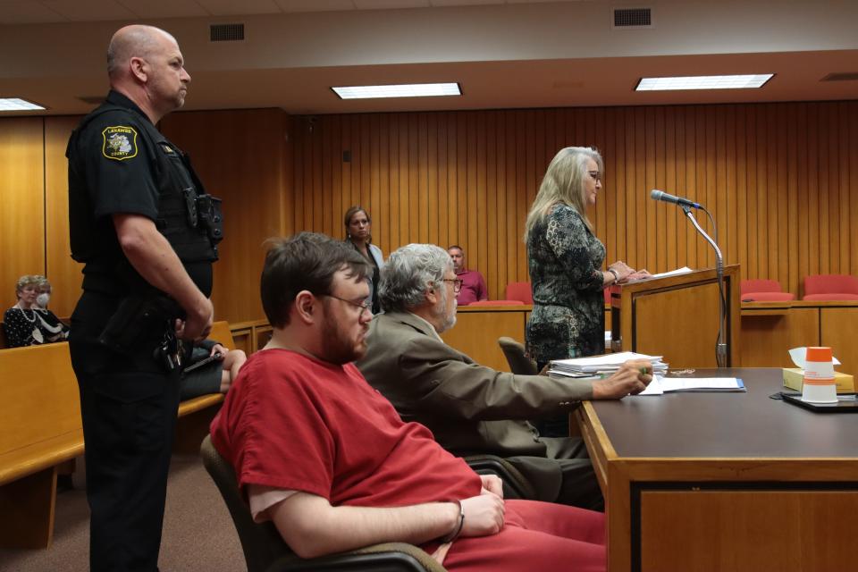 Laurie Lewis, the woman who used her concealed pistol to hold Alarik John Guajardo until police arrived after he fatally attacked Glen Harold Meyers on Sept. 16, 2020, in the Adrian Meijer store, addresses Lenawee County Circuit Judge Anna Marie Anzalone on Friday during Guajardo's sentencing. Also pictured are, from left, Detective Kevin Greca of the Lenawee County Sheriff's Office; Guajardo; Lenawee County Chief Assistant Prosecutor Jackie Wyse; and Guajardo's attorney, Lenawee County Chief Public Defender John Glaser.