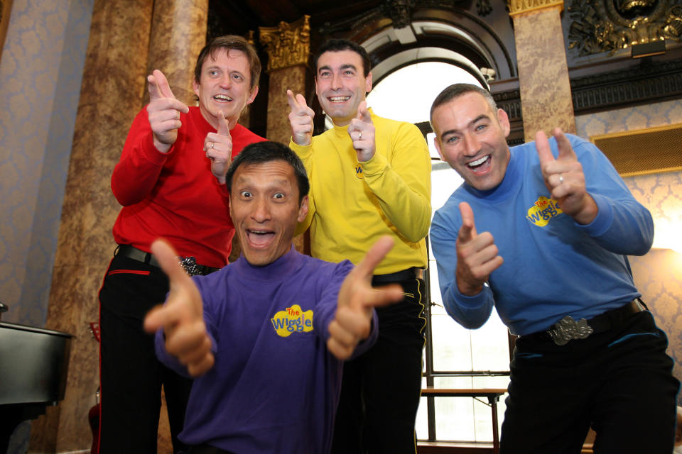 FILE - In this June 28, 2006 file photo, Australian children's entertainers The Wiggles, Murray Cook (Red Wiggle), Greg Page (Yellow Wiggle), Jeff Fatt (Purple Wiggle), and Anthony Field (Blue Wiggle) make a special appearance at the Australian High Commission in London at the start of their UK tour. Three members of the world-famous preschool quartet The Wiggles will be hanging up their colorful outfits and leaving the Australian band this year, with the Blue Wiggle the lone original member left dancing, the band said in a statement Thursday, May 17, 2012. (AP Photo/Christopher Pledger, File)