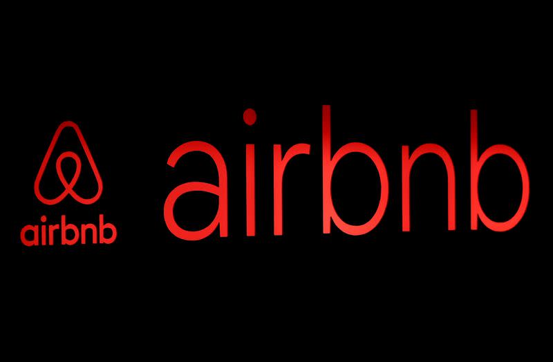 FILE PHOTO: FILE PHOTO: The logos of Airbnb are displayed at an Airbnb event in Tokyo