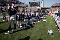 <p>Several New England Patriots players kneel during the national anthem before an NFL football game against the Houston Texans, Sept. 24, 2017, in Foxborough, Mass. (Photo: Michael Dwyer/AP) </p>