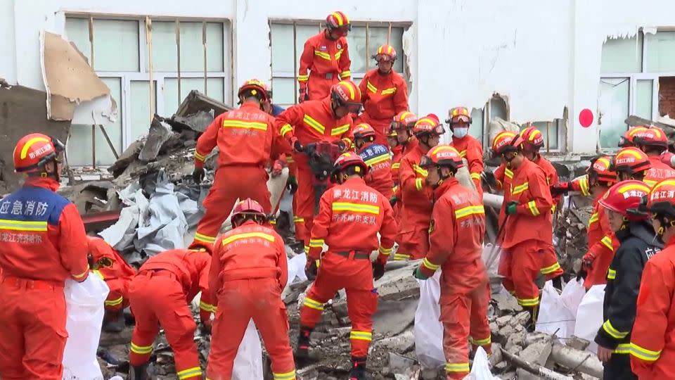 Rescue workers respond after the collapse of a roof on a middle school gymnasium in China's northeastern city of Qiqihar. - CCTV