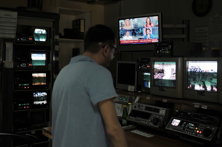 An employee works in an ERT broadcasting room on June 11, 2013. Greece's public TV and radio channels were off the air Wednesday after a shock decision by the government to shut down the state broadcaster's operations with immediate effect, a move affecting nearly 2,700 jobs