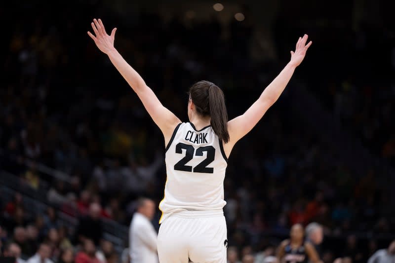 Iowa guard Caitlin Clark celebrates during a game against Louisville, Sunday, March 26, 2023.