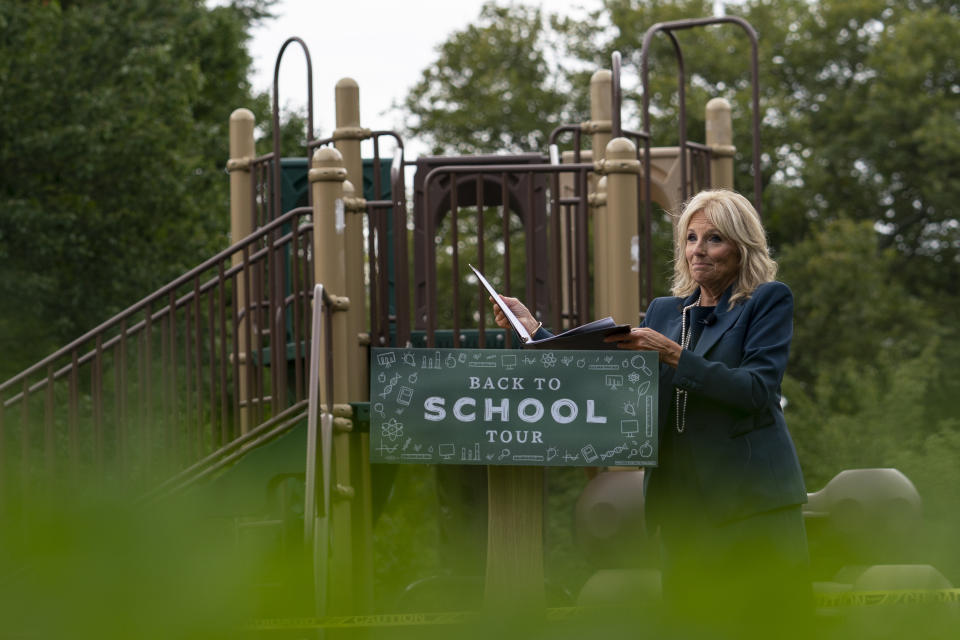 FILE - In this Sept. 1, 2020, file photo Jill Biden, wife of Democratic presidential candidate former Vice President Joe Biden, walks from a podium in front of a closed playground during a tour of the Evan G. Shortlidge Academy in Wilmington, Del. In an election year where reopening schools shuttered by the coronavirus pandemic is emerging as a flashpoint, Jill Biden is increasingly drawing on her experience in the classroom to empathize with parents struggling to cope with the shift to virtual learning. (AP Photo/Carolyn Kaster, File)