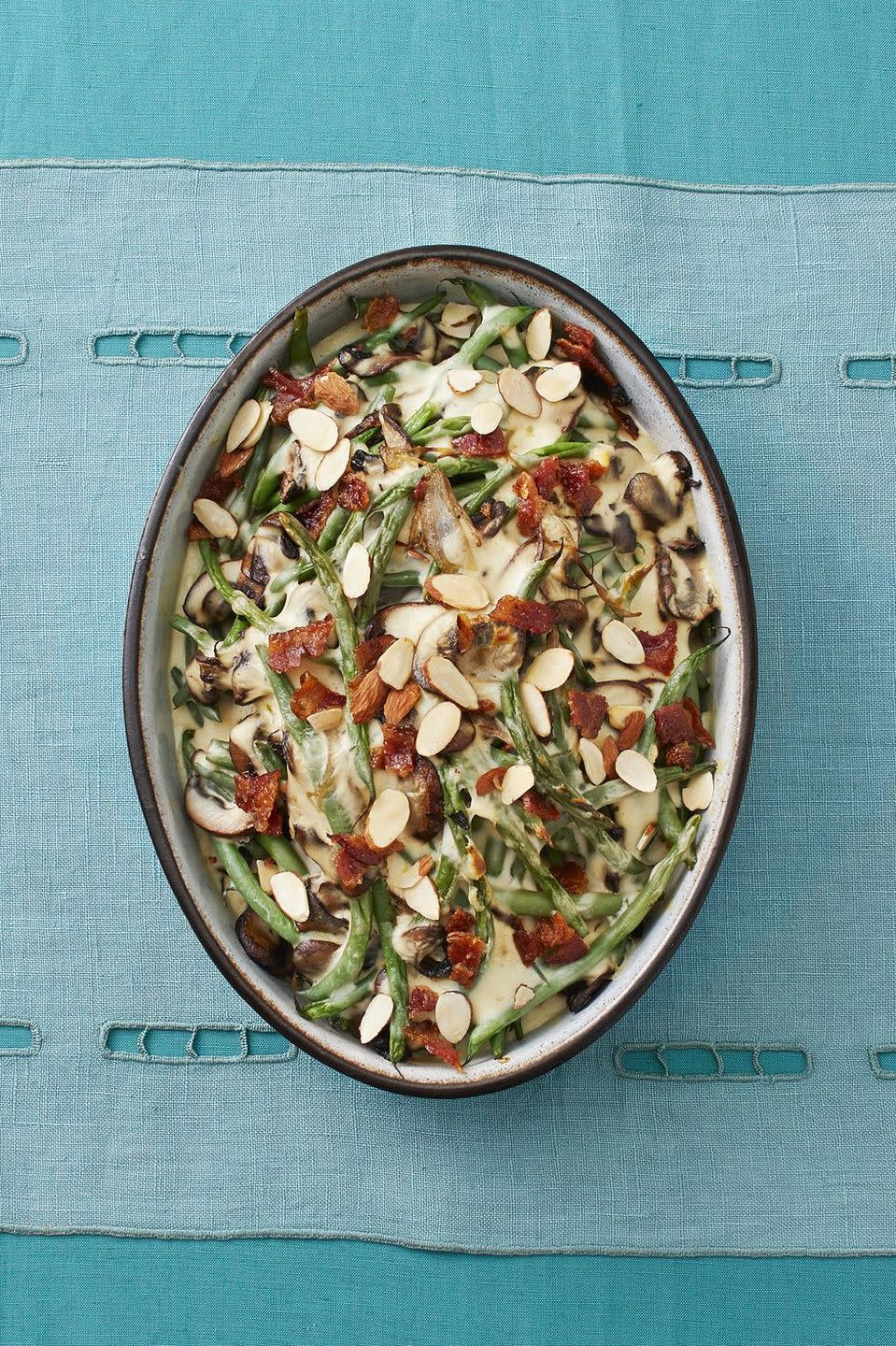 <p>A green bean casserole is all but expected at a Southern Thanksgiving dinner. Here, brown sugar and toasted, sliced almonds add sweetness and crunch to an already mouthwatering side.</p><p><strong><a href="https://www.thepioneerwoman.com/food-cooking/recipes/a33250059/green-bean-mushroom-casserole-with-candied-bacon-recipe/" rel="nofollow noopener" target="_blank" data-ylk="slk:Get the recipe.;elm:context_link;itc:0;sec:content-canvas" class="link ">Get the recipe.</a></strong><br></p><p><a class="link " href="https://go.redirectingat.com?id=74968X1596630&url=https%3A%2F%2Fwww.walmart.com%2Fsearch%3Fq%3Dpioneer%2Bwoman%2Bcasserole%2Bdish&sref=https%3A%2F%2Fwww.thepioneerwoman.com%2Ffood-cooking%2Fmeals-menus%2Fg33834710%2Fsouthern-thanksgiving-menu%2F" rel="nofollow noopener" target="_blank" data-ylk="slk:SHOP CASSEROLE DISHES;elm:context_link;itc:0;sec:content-canvas">SHOP CASSEROLE DISHES</a></p>