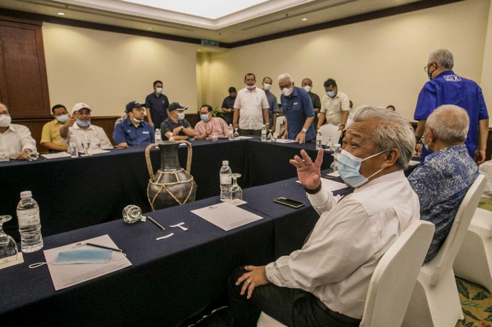 Sabah Umno chief Datuk Seri Bung Moktar Radin waves at reporters during a meeting with Gabungan Rakyat Sabah leaders at the Magellan Sutera Resort in Kota Kinabalu September 27, 2020. — Picture by Firdaus Latif