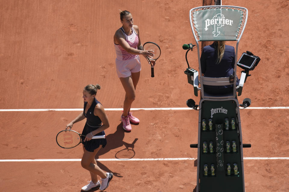 Aryna Sabalenka of Belarus, top, and Ukraine's Marta Kostyuk, left, refused to shake hands at the end of their first round match of the French Open tennis tournament at the Roland Garros stadium in Paris, Sunday, May 28, 2023. Sabalenka won in two sets, 6-3, 6-2. (AP Photo/Christophe Ena)
