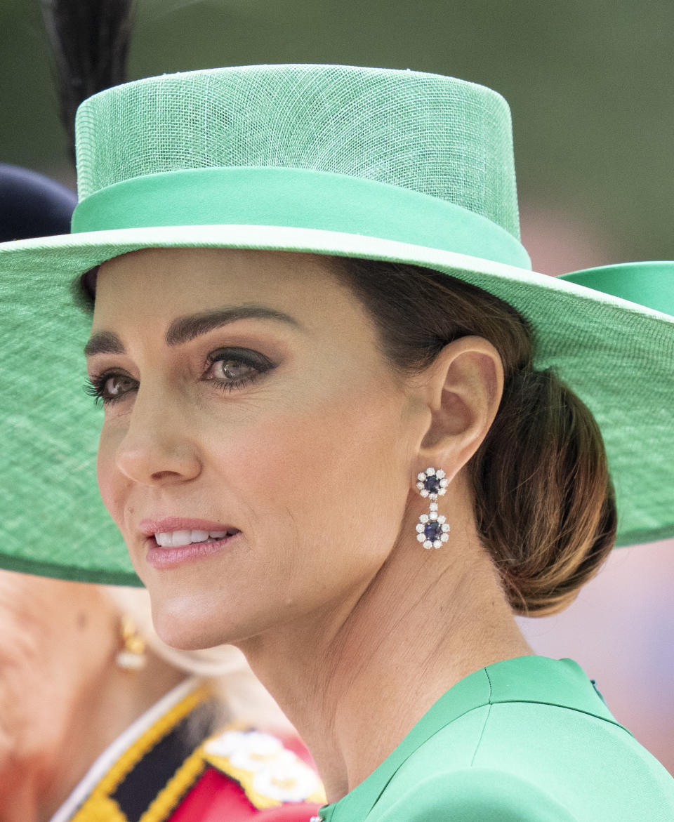 Kate Middleton in green dress and hat and sapphire and diamond earrings at Trooping the Colour