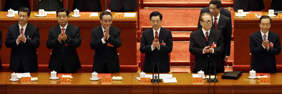 Chinese leaders from left, Vice President Xi Jinping, Chairman of the Chinese People's Political Consultative Conference Jia Qinglin, National People's Congress Chairman Wu Bangguo, Chinese President Hu Jintao, former Chinese President Jiang Zemin and Chinese Premier Wen Jiabao applaud during the closing ceremony for the 18th Communist Party Congress held at the Great Hall of the People in Beijing Wednesday, Nov. 14, 2012. (AP Photo/Ng Han Guan)
