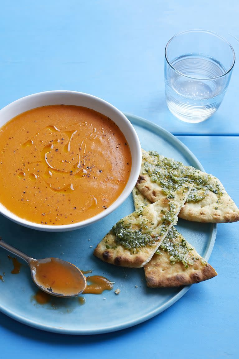 <p>Complementing this spiced tomato soup are flatbreads smothered in an herbed butter and coconut spread. </p><p><em>Get the <a href="https://www.womansday.com/food-recipes/food-drinks/recipes/a59774/spiced-tomato-soup-flatbread-recipe/" rel="nofollow noopener" target="_blank" data-ylk="slk:Spiced Tomato Soup with Flatbread recipe;elm:context_link;itc:0;sec:content-canvas" class="link ">Spiced Tomato Soup with Flatbread recipe</a>.</em></p>