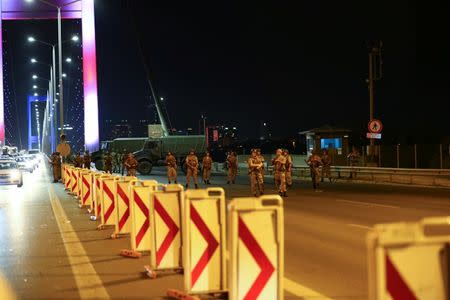 Turkish military block access to the Bosphorus bridge, which links the city's European and Asian sides, in Istanbul, Turkey, July 15, 2016. REUTERS/Stringer - RTSI72B