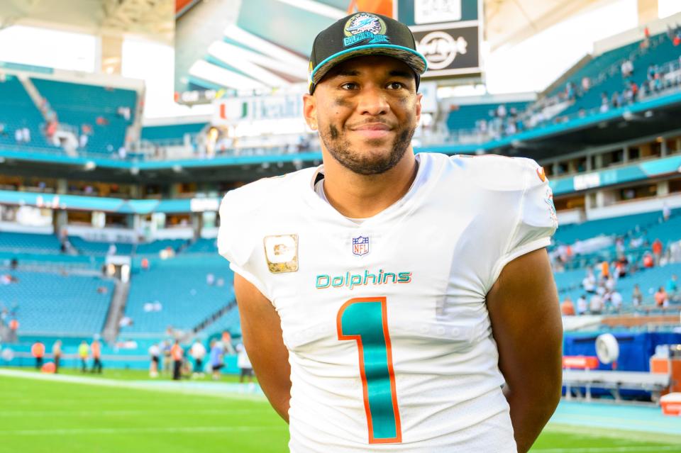 Miami Dolphins quarterback Tua Tagovailoa (1) smiles on the field after the Dolphins defeated the Cleveland Browns during an NFL football game, Sunday, Nov. 13, 2022, in Miami Gardens, Fla.