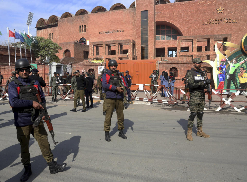 Pakistani paramilitary and police officers stand guard outside the Gaddafi stadium to ensure security for the second T20 cricket match between Pakistan and Bangladesh, in Lahore, Pakistan, Saturday, Jan. 25, 2020. (AP Photo/K.M. Chaudary)