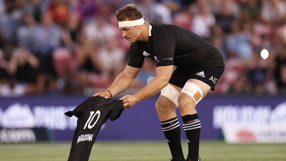 All Blacks skipper Sam Cane is seen here paying tribute to Diego Maradona.