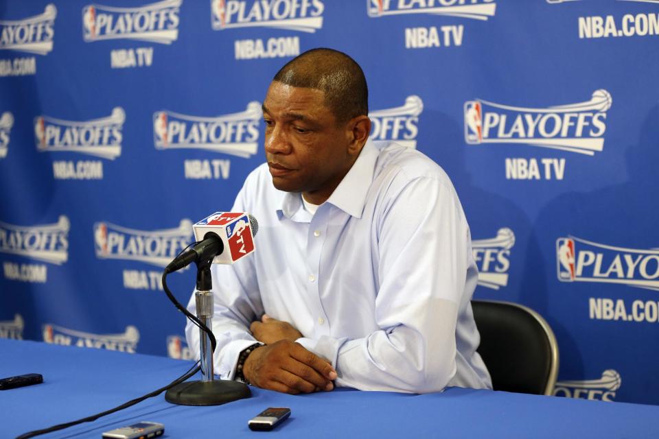 Los Angeles Clippers head coach Doc Rivers, right, answers questions during a pregame news conference before Game 4 of an opening-round NBA basketball playoff series against the Golden State Warriors on Sunday, April 27, 2014, in Oakland, Calif. (AP Photo/Marcio Jose Sanchez)