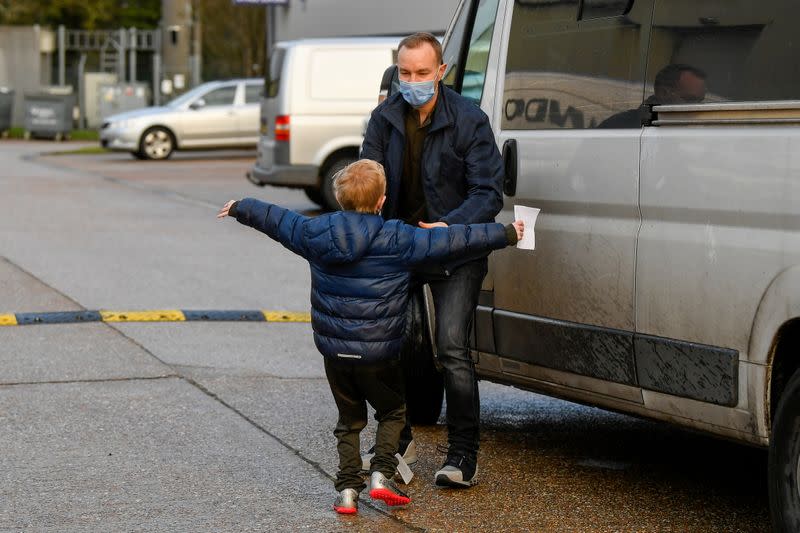 Tom Hayes reacts with his son Josh, after being released from HM Prison Ford, in Arundel