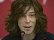 FILE - U.S. Olympic Snowboarder Shaun White speaks at a press conference in Turin Italy, Feb. 6, 2006. The Beijing Olympics will be the fifth Olympics for the three-time gold medalist. And the last Olympics for the 35-year-old — get this — elder-statesman who is now more than double the age of some of the riders he goes against. (AP Photo/Greg Baker, File)