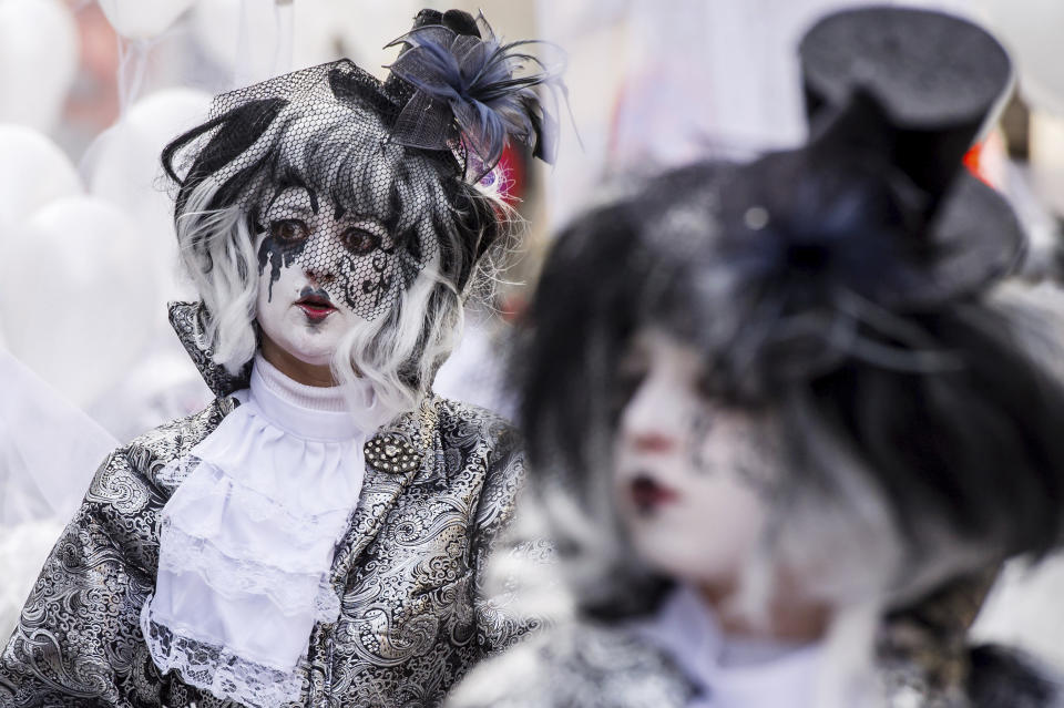 FILE - In this Sunday, Feb. 10, 2013 file photo, people celebrate carnival during the yearly procession in Aalst, Belgium. The famed Belgian carnival town of Aalst on Sunday, Dec. 1, 2019 is renouncing its place on the U.N.'s cultural agency heritage list saying it was sick of the widespread complaints that this spring's edition contained blatant anti-Semitism and insisted no one should try to muzzle humor of any kind. (AP Photo/Geert Vanden Wijngaert, File)