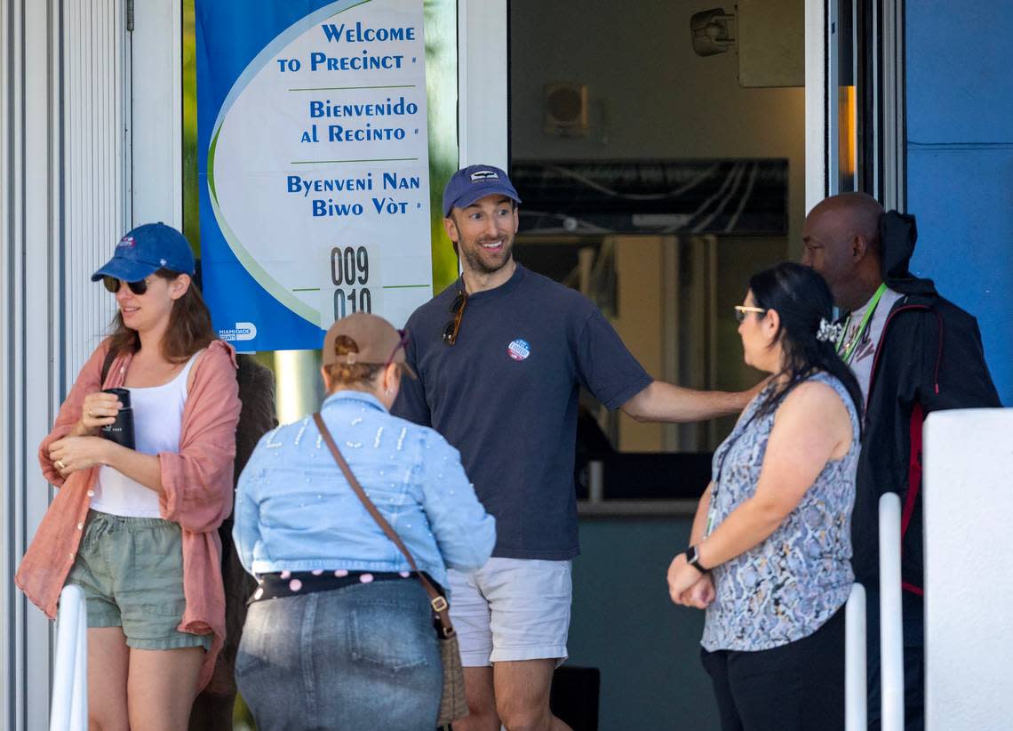 Poll workers greet voters during the presidential primary and local election in Miami-Dade County at Surfside Town Hall on Tuesday, March 19, 2024, in Surfside, Florida.