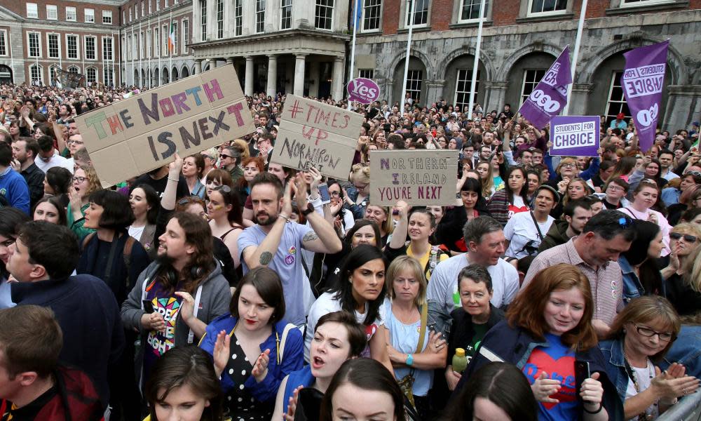 Yes campaigners hold posters calling for Northern Ireland to liberalise its strict abortion laws.