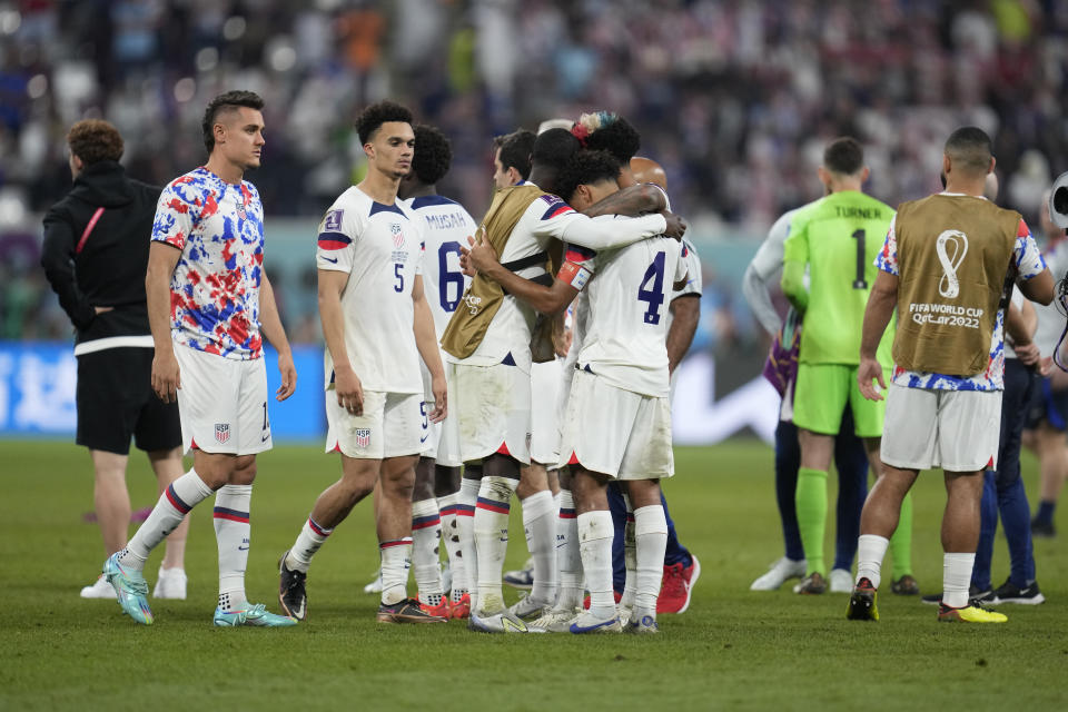 U.S. players react at the end of the World Cup round of 16 soccer match between the Netherlands and the United States, at the Khalifa International Stadium in Doha, Qatar, Saturday, Dec. 3, 2022. (AP Photo/Natacha Pisarenko)