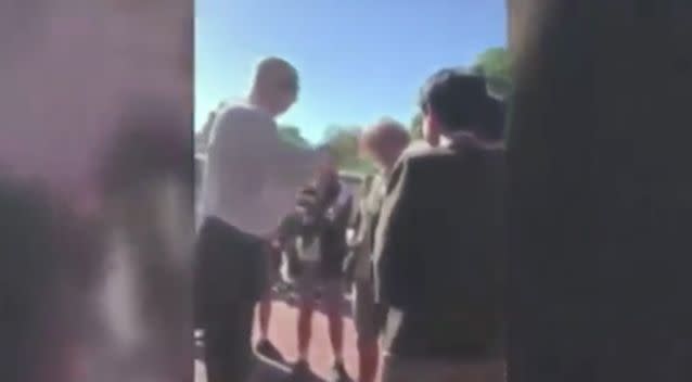 Footage emerged online of Mr Brown cutting a student's hair. Source: 7 News