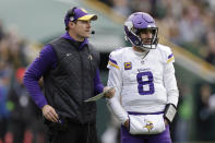 Minnesota Vikings head coach Kevin O'Connell and quarterback Kirk Cousins (8) stand on the field during the second half of an NFL football game against the Green Bay Packers, Sunday, Oct. 29, 2023, in Green Bay, Wis. (AP Photo/Matt Ludtke)
