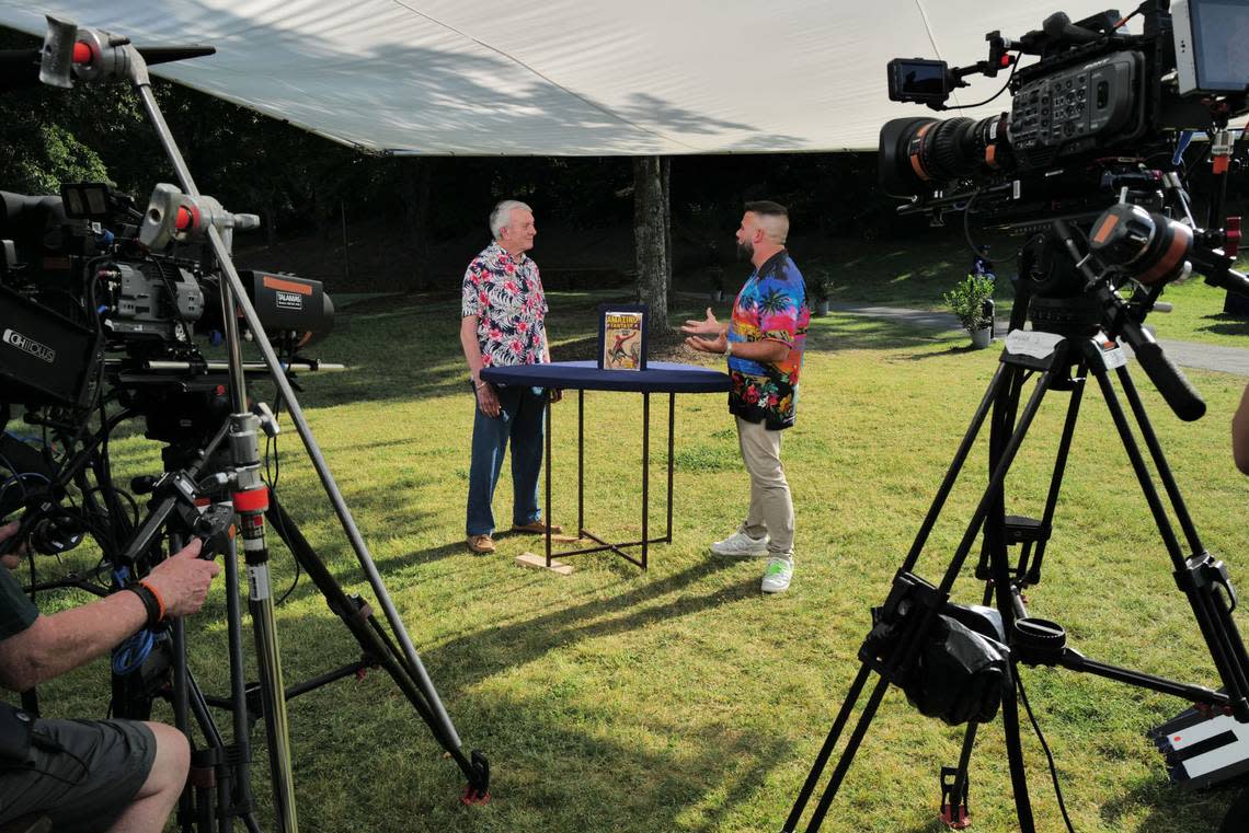 Cameras record expert Travis Landry (right) appraising a comic book on set at at a taping of the PBS hit series “Antiques Roadshow” at the North Carolina Museum of Art in Raleigh on Tuesday, May 16, 2023, as part of the series 28th season tour.